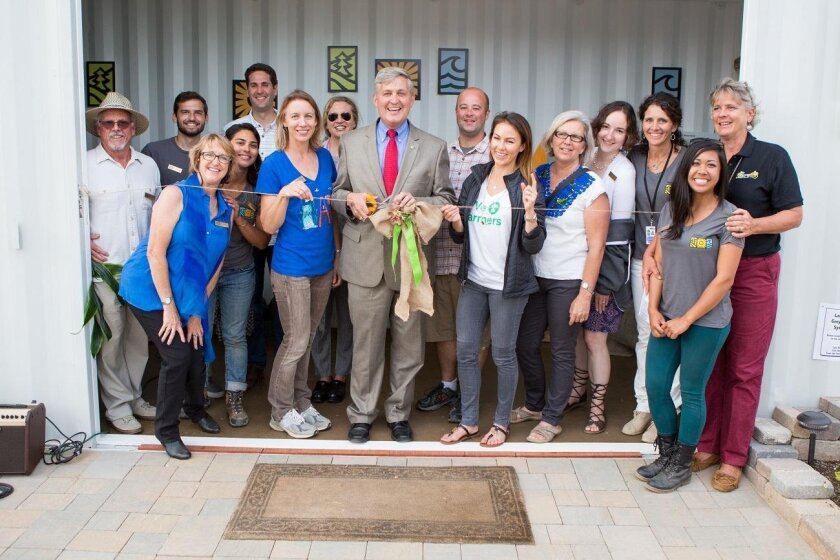 At the San Diego County Fair, County Supervisor Dave Roberts cuts the ribbon for the unveiling of the Solana Center’s Eco Container.