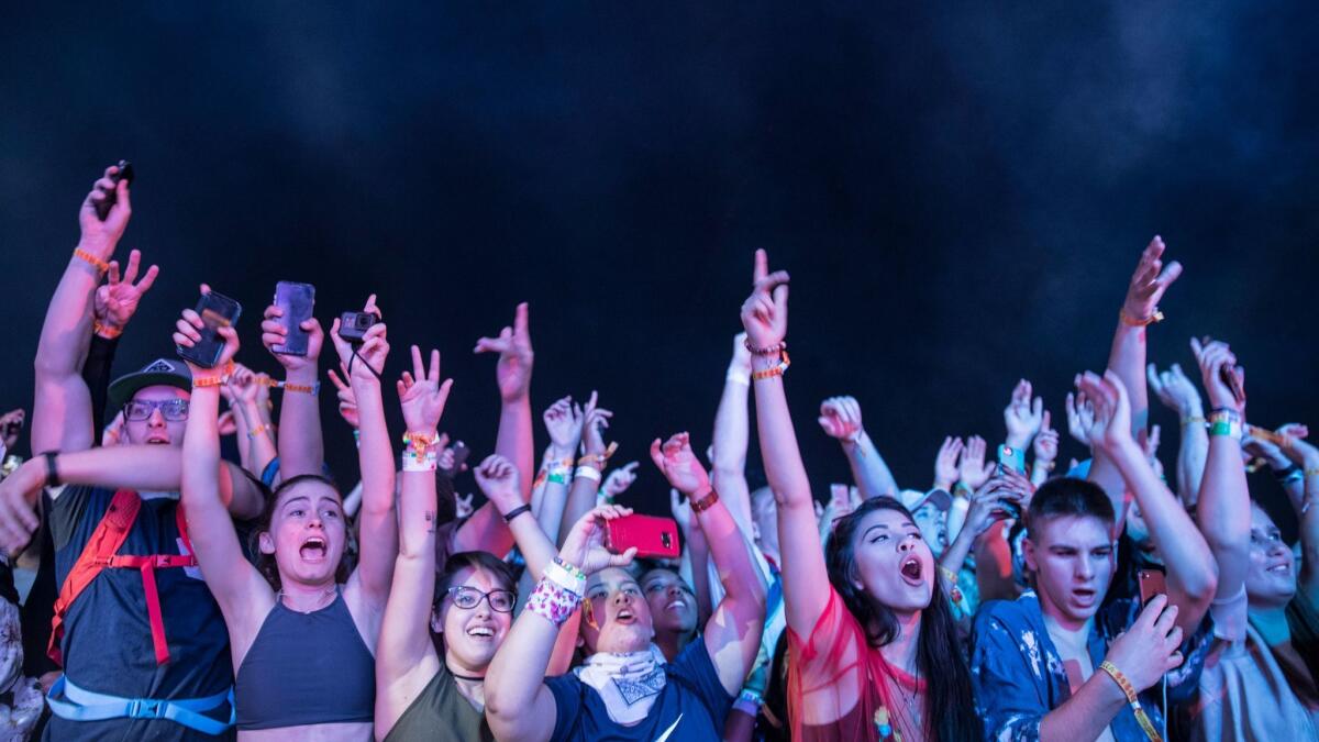 Fans jump to ScHoolboy Q at the Coachella Music and Arts Festival in April.