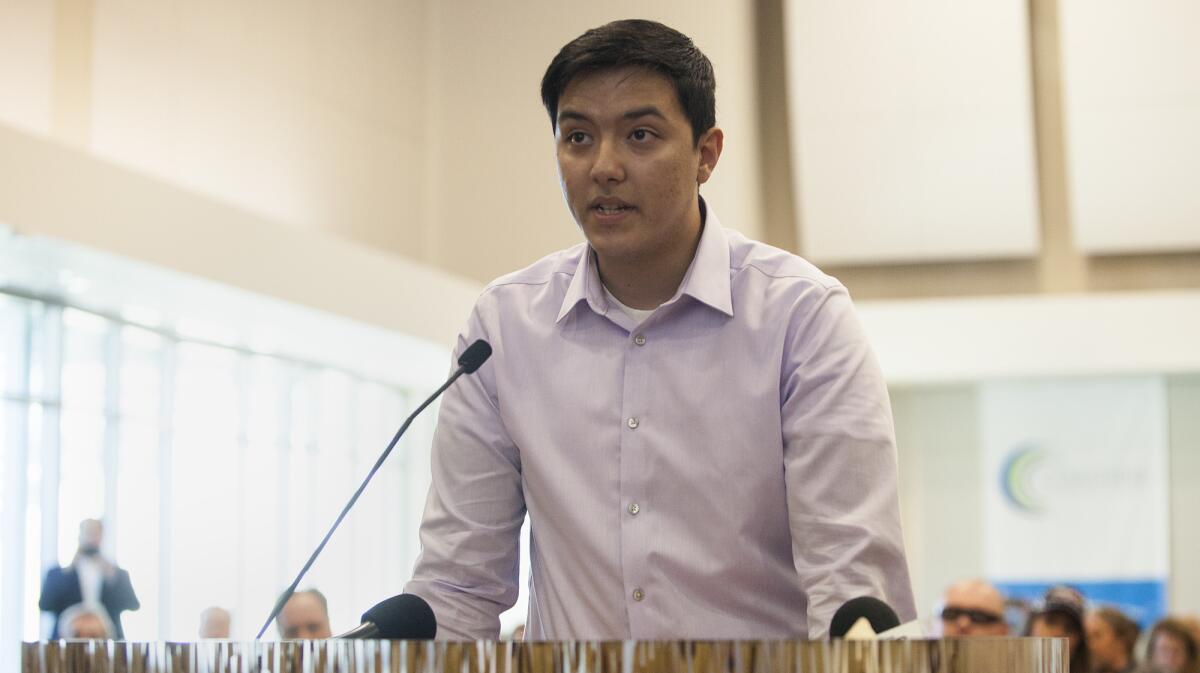 Joshua Recalde-Martinez, former president of the Orange Coast College Republicans club, addresses the Coast Community College District board Wednesday as he and others argue to revoke human-sexuality professor Olga Perez Stable Cox's OCC Faculty of the Year award.