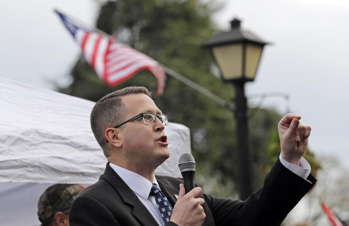 State Rep. Matt Shea speaks at a January gun-rights rally at the Capitol in Olympia, Wash.