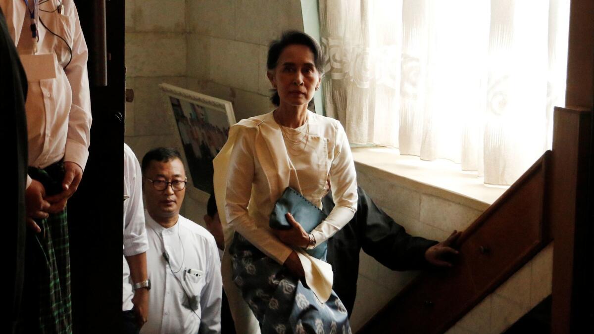 Myanmar State Counselor Aung San Suu Kyi arrives at a memorial ceremony in February for Ko Ni, a prominent legal advisor to her government, and taxi driver Ne Win. (Thein Zaw / Associated Press)