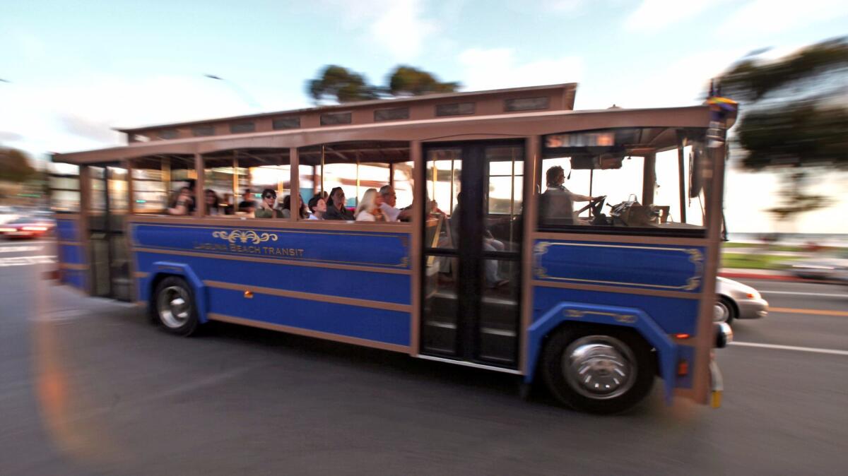 The Laguna Beach south route trolley roars past Forest Avenue after a day of moving riders around the city.