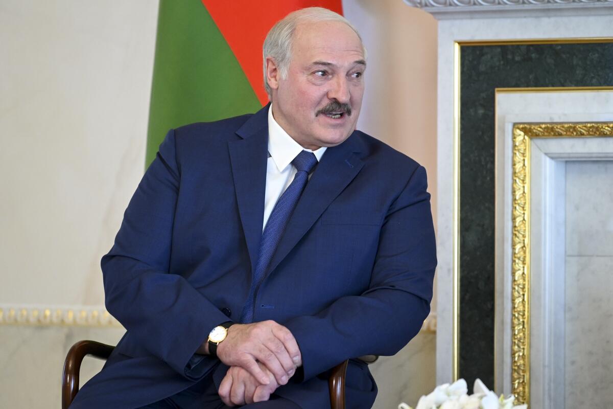 Belarusian President Alexander Lukashenko listens to Russian President Vladimir Putin during their meeting in St. Petersburg, Russia, Tuesday, July 13, 2021. Putin has hosted the leader of Belarus, who has increasingly relied on Moscow's support amid increasing tensions with the West. Belarus' authoritarian President Alexander Lukashenko thanked Putin for a "very serious support from Russia" and pledged that his country will duly repay its loans. (Alexei Nikolsky, Sputnik, Kremlin Pool Photo via AP)