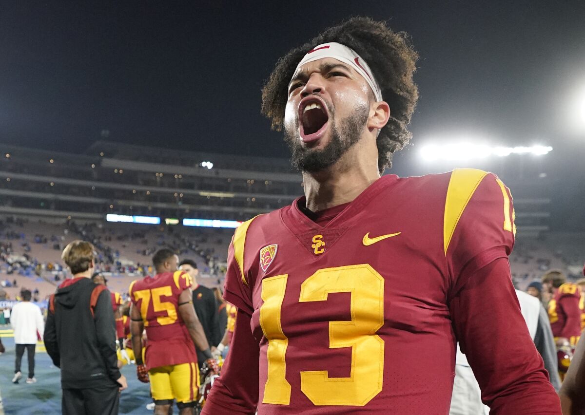 USC quarterback Caleb Williams, left, celebrates after USC defeated UCLA at the Rose Bowl on Nov. 19.