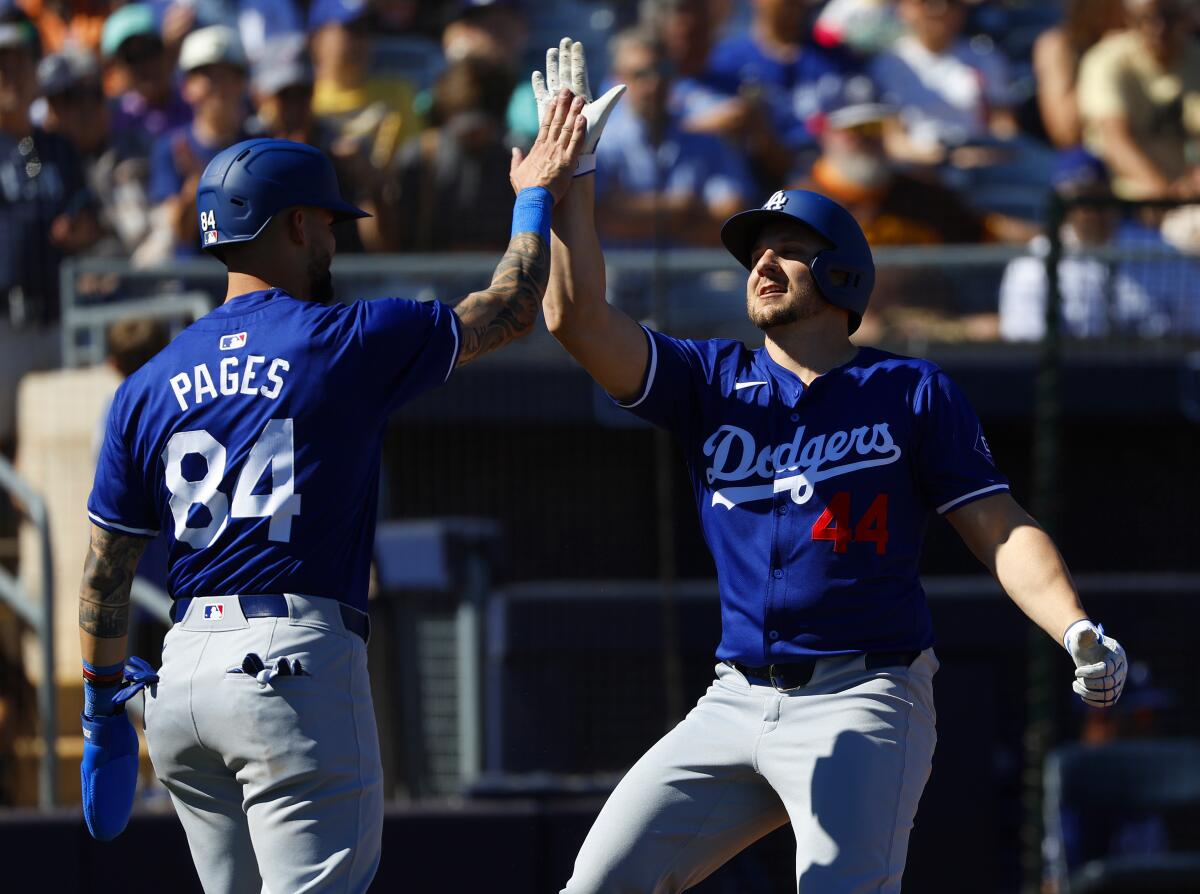 The Dodgers' Kevin Padlo, right, celebrates with Andy Pages