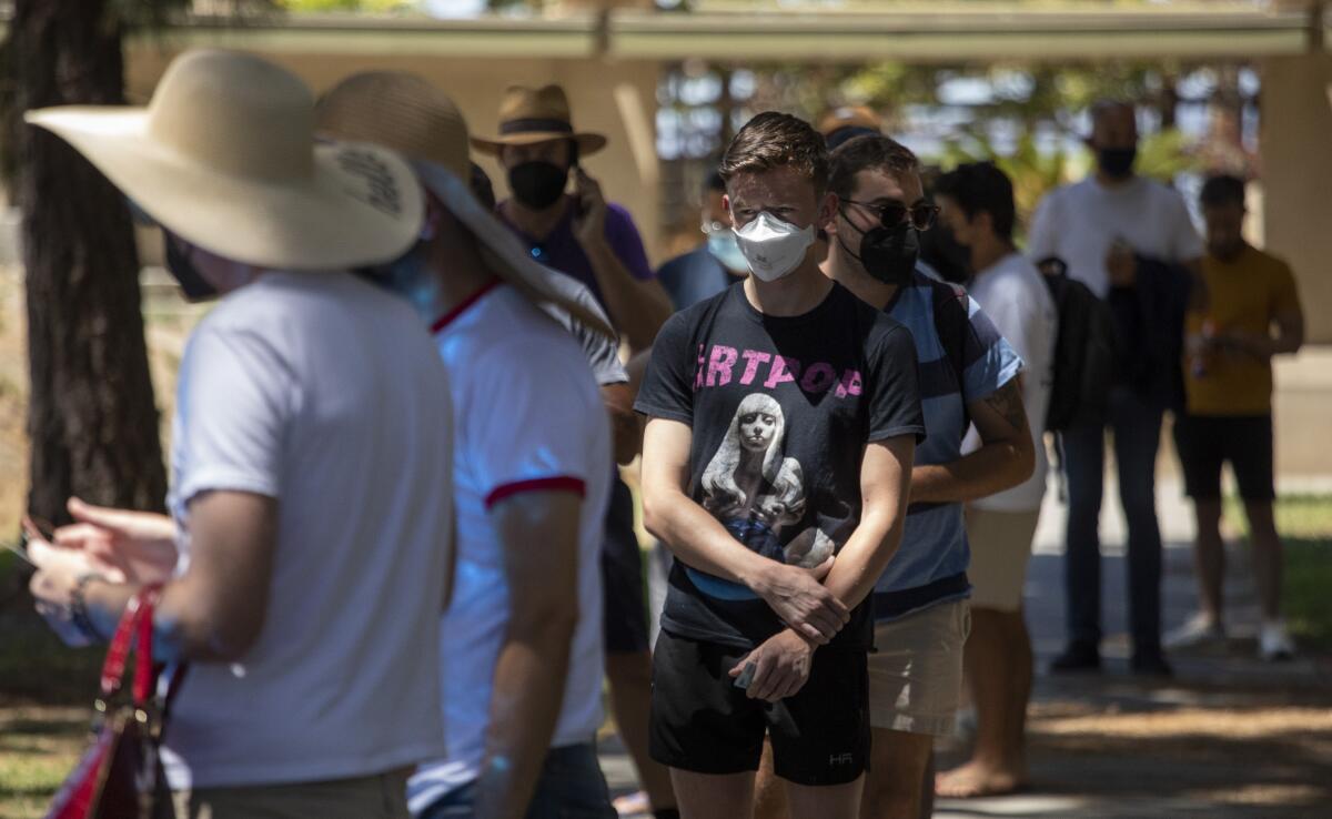 People line up Tuesday to get a monkeypox vaccination at a new walk-up vaccination site in Hollywood.