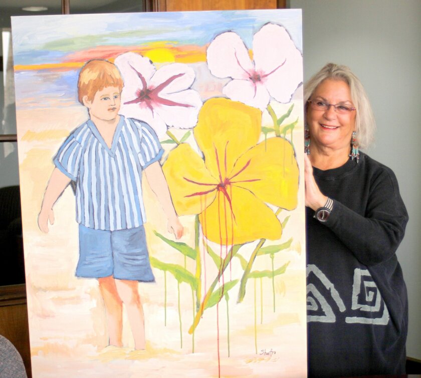 Judy Shufro with one of her paintings