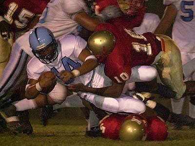 Carson High quarterback Boneigh Napoleon (14),