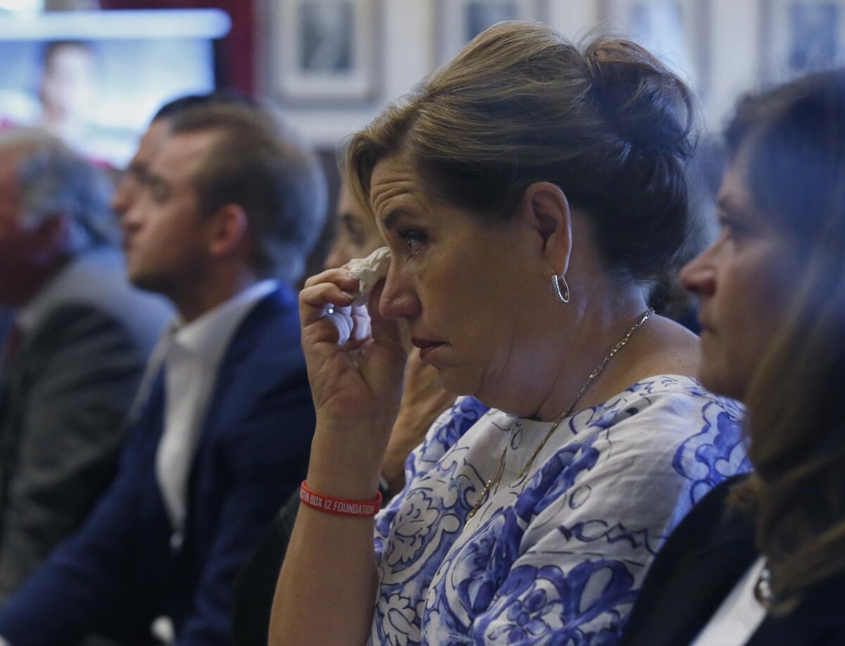 Gail Box listens during closing arguments in Oklahoma's opioid lawsuit against Johnson & Johnson. Her son, former University of Oklahoma football player Austin Box, died of a drug overdose in 2011.