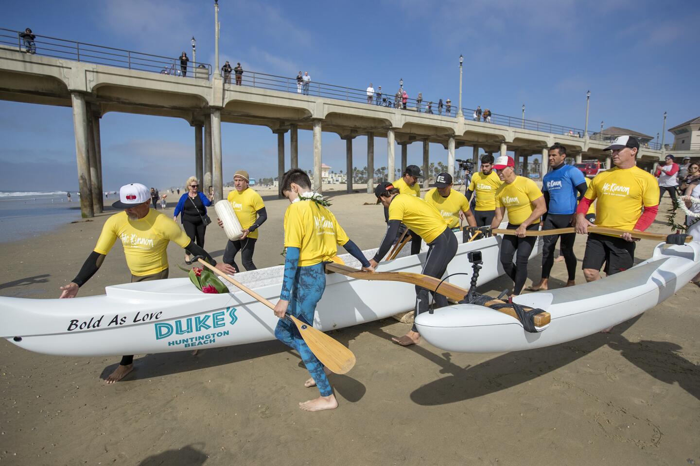 Outrigger surf canoe rides start at the Huntington Beach Pier