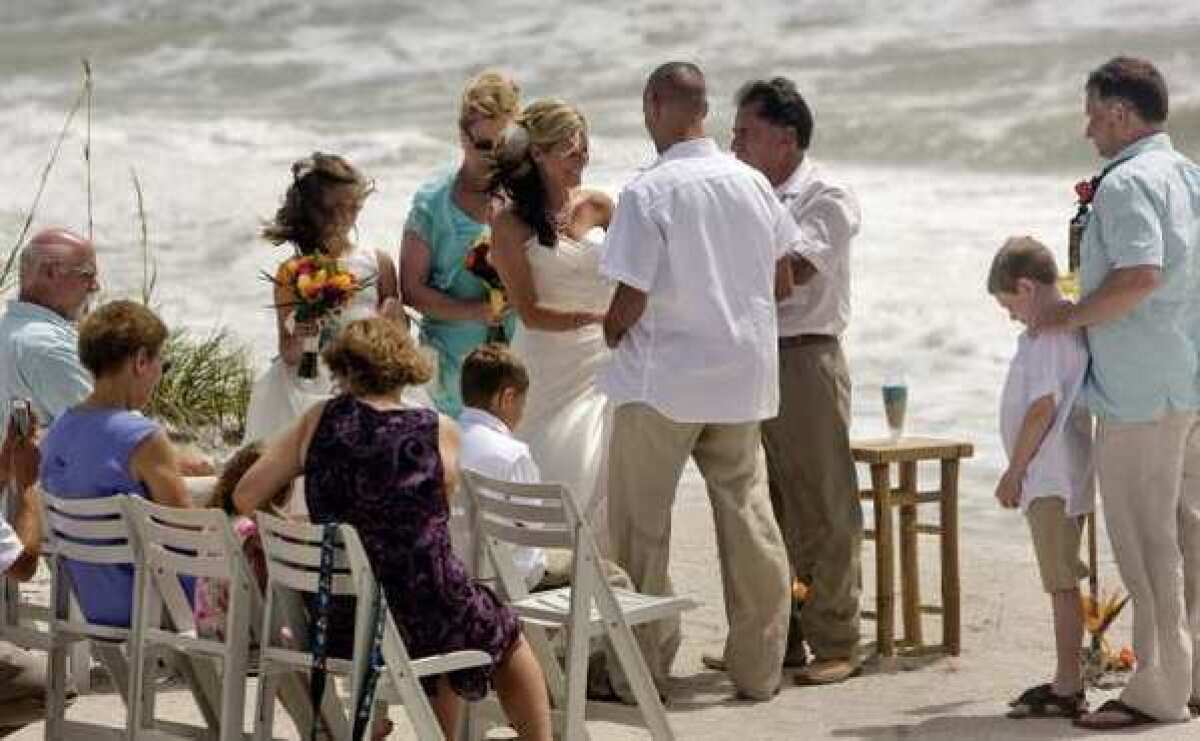 Amy Hartley, 28, and Thomas Sartin, 40, exchanged wedding vows at Indian Rocks Beach, Fla., last month.