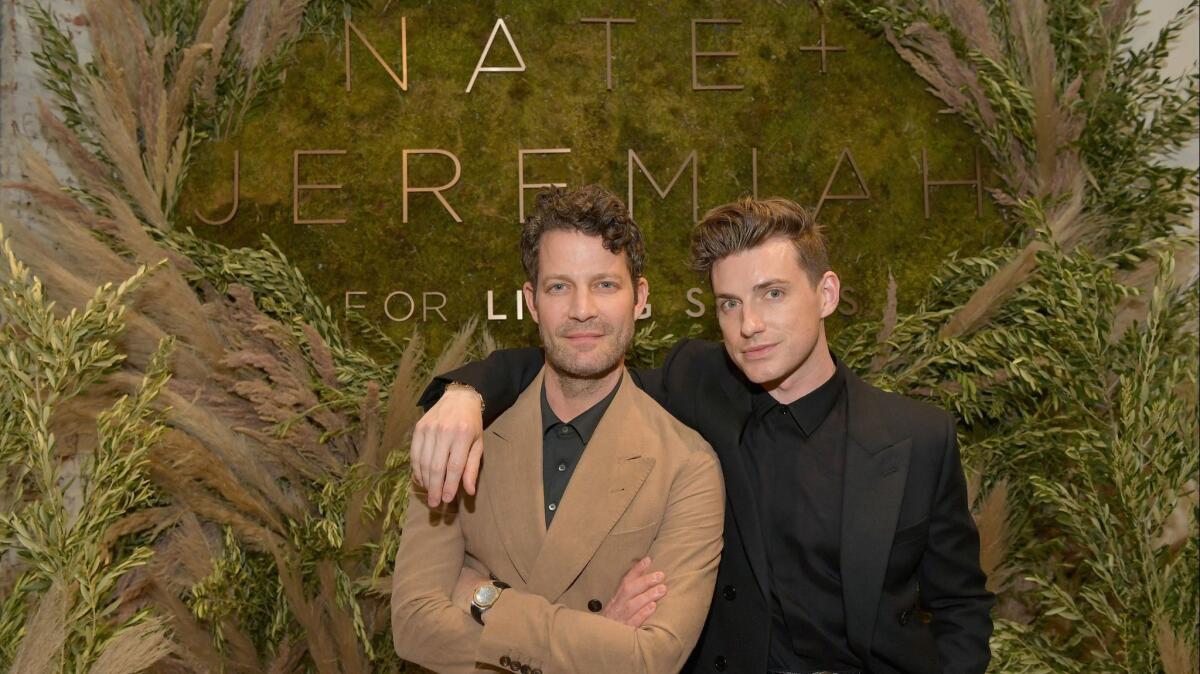 Designers and partners Nate Berkus, left, and Jeremiah Brent attend Nate + Jeremiah for Living Spaces in Los Angeles.