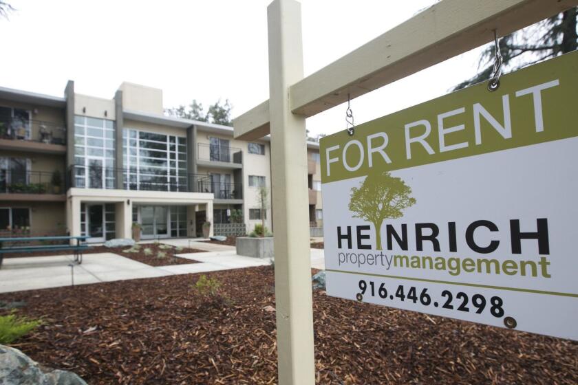 FILE - In this Jan. 8, 2018, file photo "For Rent" sign is posted outside an apartment building in Sacramento, Calif. Californians who rent apartments built after 1995, single-family homes or condominiums have limited protections from rising costs under a state law passed that year that restricts rent control. That could change if voters pass Proposition 10 in November. It would overturn the 1995 law and open the door to more rent control in cities and counties across the state. (AP Photo/Rich Pedroncelli, File)