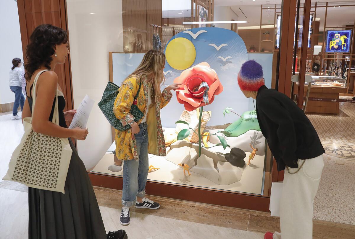 Sierra Herecia, Ella Brynteson and Tetsuma Morino at South Coast Plaza's Hermes storefront.