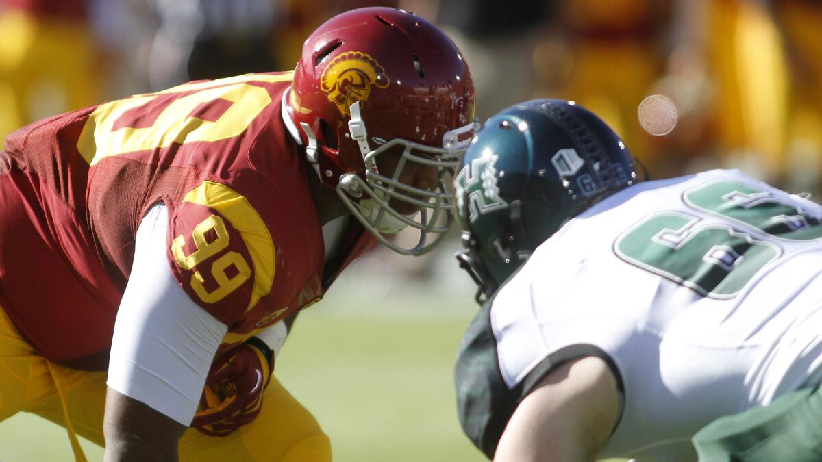 USC defensive lineman Antwaun Woods lines up during a game against Hawaii in on Sept. 1, 2012.