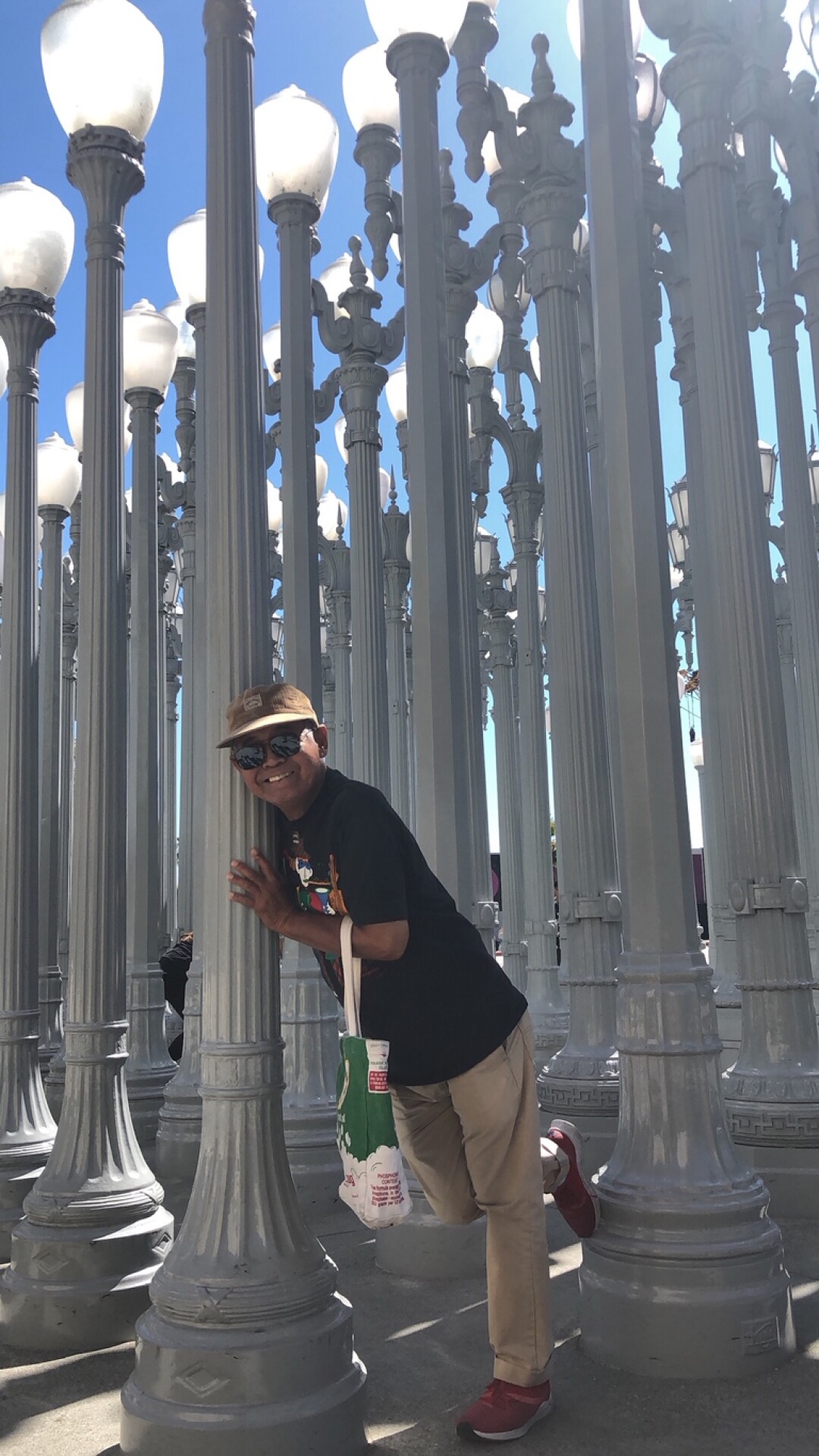 Ben Barcelona in happier times, at LACMA’s “Urban Light,” on one of his Thursday visits in July 2019. 