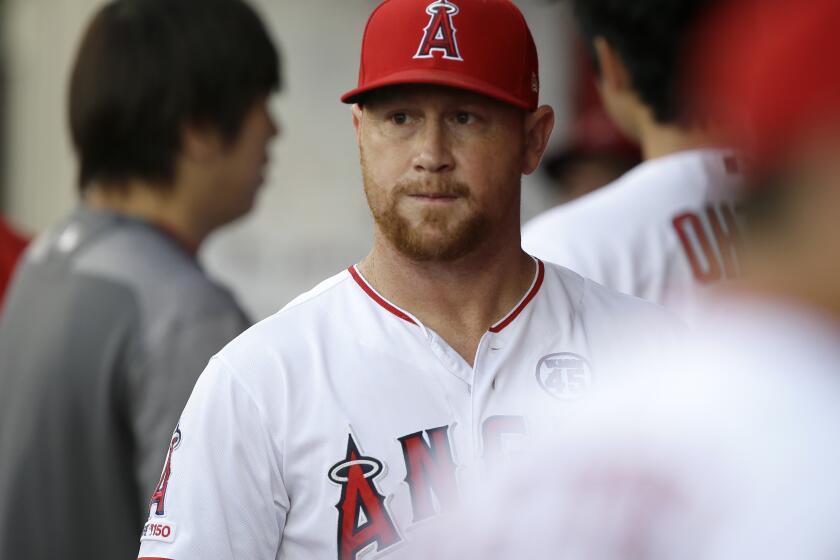 Los Angeles Angels' Kole Calhoun looks over from the dugout before a baseball game against the Detroit Tigers in Anaheim, Calif., Tuesday, July 30, 2019. (AP Photo/Alex Gallardo)