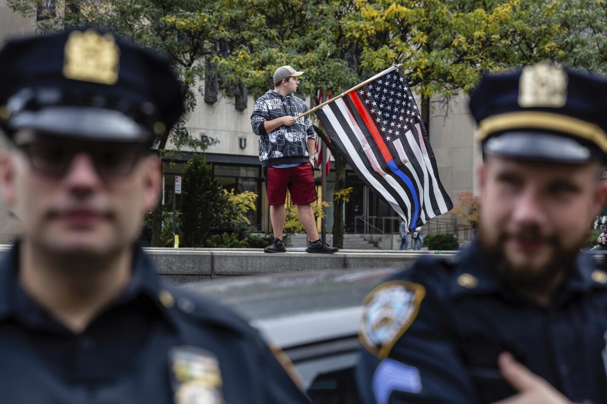 New York City municipal workers protest outside City Hall 