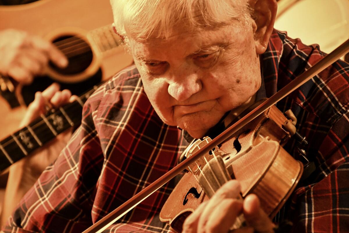 The Station Inn, a favorite Nashville roots music venue, holds bluegrass jam sessions on Sunday nights. Here, fiddler John Hagar, in his 80s, takes a solo.