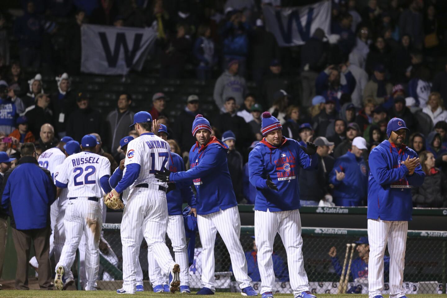 Cubs players celebrate after defeating the Pittsburgh Pirates 6-2.