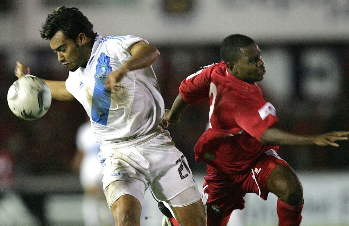 Panamanian Carlos Rivera (R) vies for the ball with Guatemalan Carlos Ruiz at the Rommel Fernandez stadium in Panama, 09 February 2005, during the FIFA 2006 World Cup North and Central America and Caribbean region final-round qualifying match.