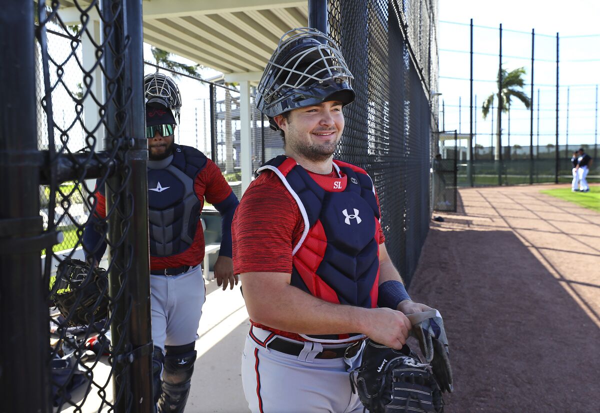 Atlanta Braves top prospect catcher Shea Langeliers smiles as he takes the field for the first day of Braves minor league spring training camp on Sunday, March 6, 2022, in North Port, Fla. (Curtis Compton/Atlanta Journal-Constitution via AP)
