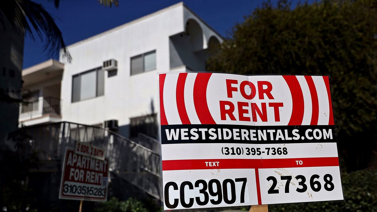A "for rent" sign is posted in front of an apartment building in Los Angeles.