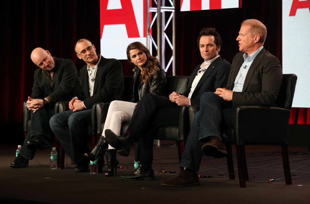 "The Americans" executive producer Joe Weisberg, from left, executive producer Joel Fields and actors Keri Russell, Matthew Rhys and Noah Emmerich discuss the Cold War espionage drama's upcoming second season during the FX portion of the 2014 Television Critics Assn. press tour in Pasadena.