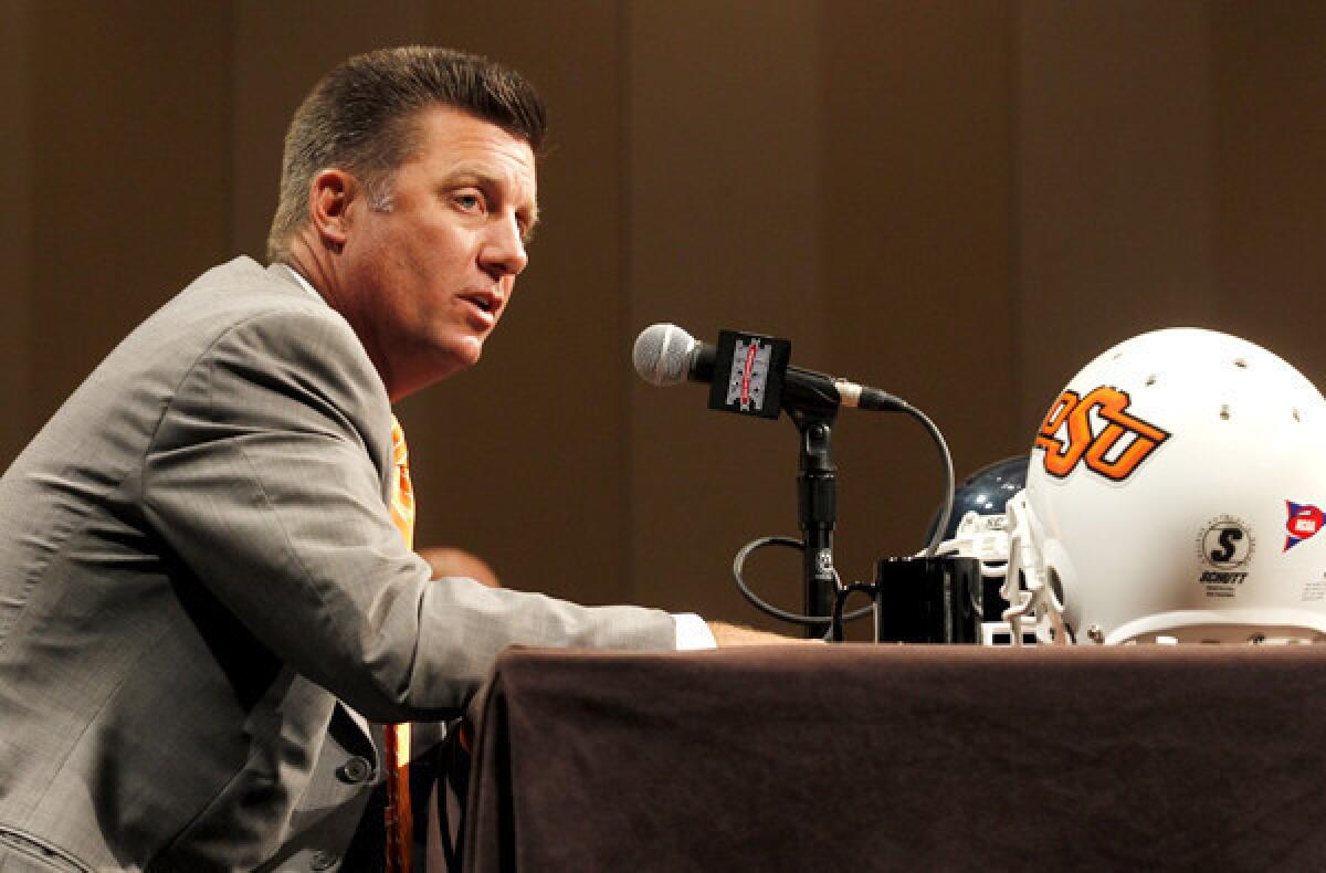 Oklahoma State Coach Mike Gundy, a former quarterback for the Cowboys, has been head coach since 2005. He returned to his alma mater in 2001 as an assistant.