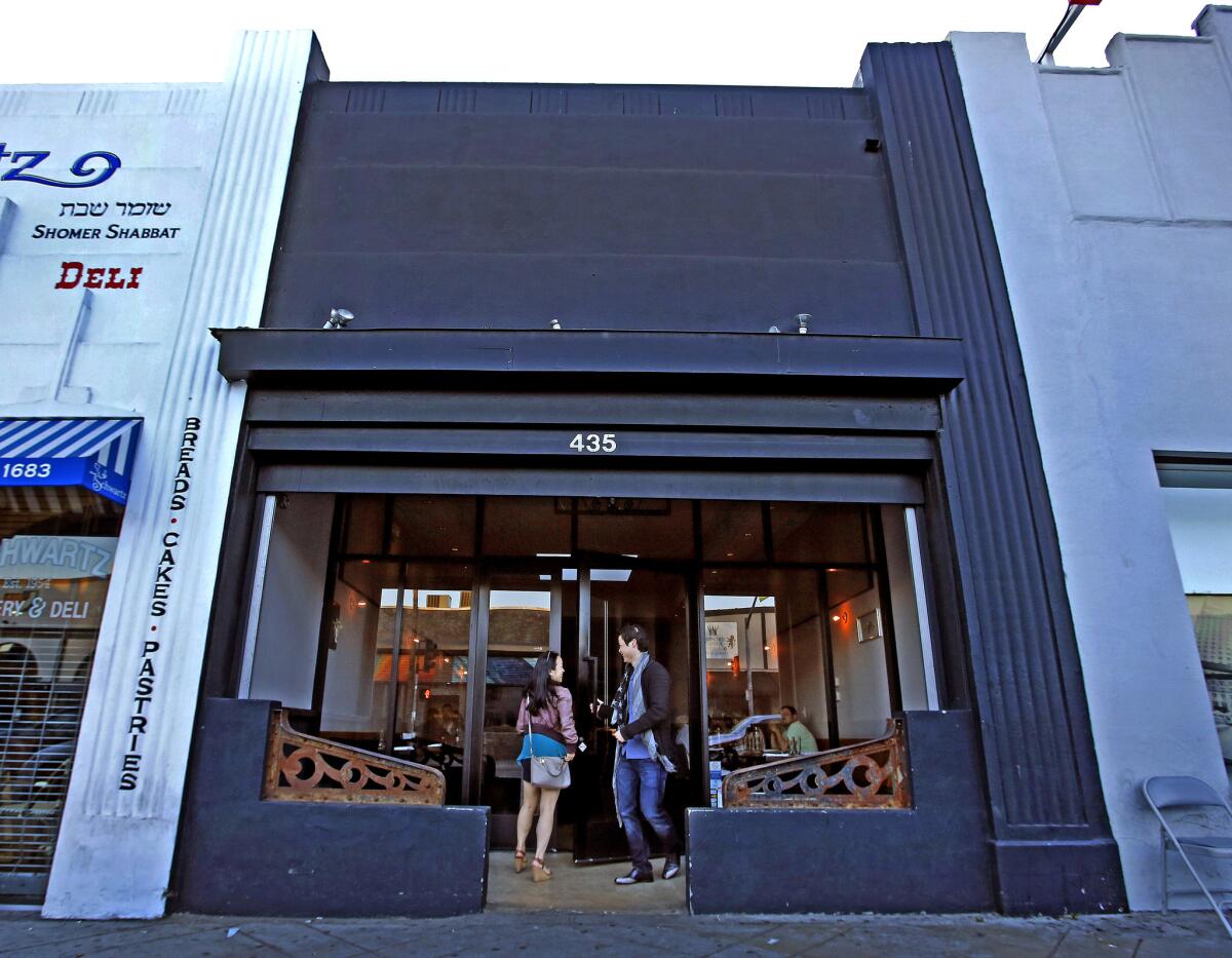 Customers enter Animal Restaurant on Fairfax Ave. in Los Angeles.