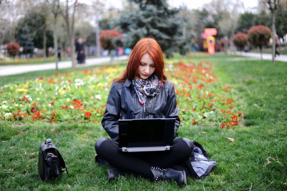 A woman uses her laptop in Istanbul.