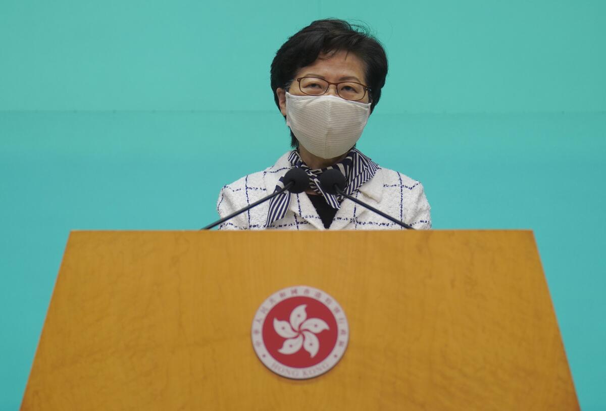 Hong Kong Chief Executive Carrie Lam listens to reporters' questions during a news conference Tuesday.