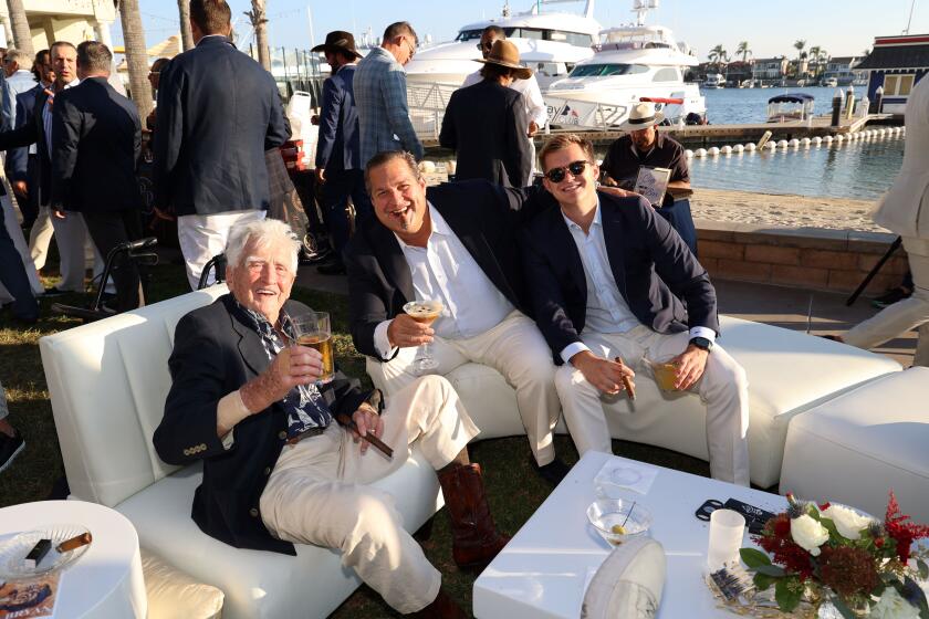 Henry Schielein, founder of the smoker, Danny Thomas and his son, Jake Thomas at the Balboa Bay Club & Resort.