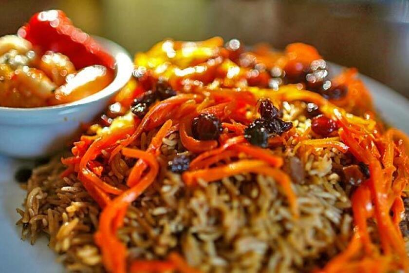 A signature entree at Chili Chutney in Lake Forest: quabuli pallow, a basmati fried rice cooked with lamb and spices garnished with carrots and raisins.