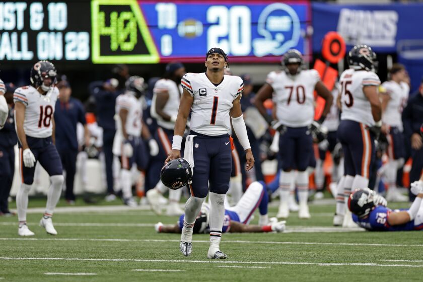 Chicago Bears quarterback Justin Fields (1) reacts at the end of the game against the New York Giants during an NFL football game Sunday, Oct. 2, 2022, in East Rutherford, N.J. (AP Photo/Adam Hunger)