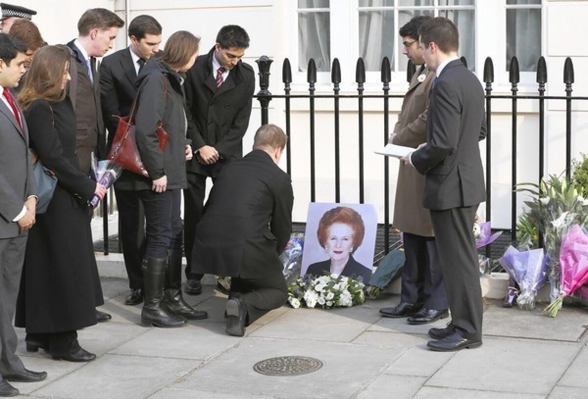 People pay their respects to former Prime Minister Margaret Thatcher outside her residence in Chester Square in London.