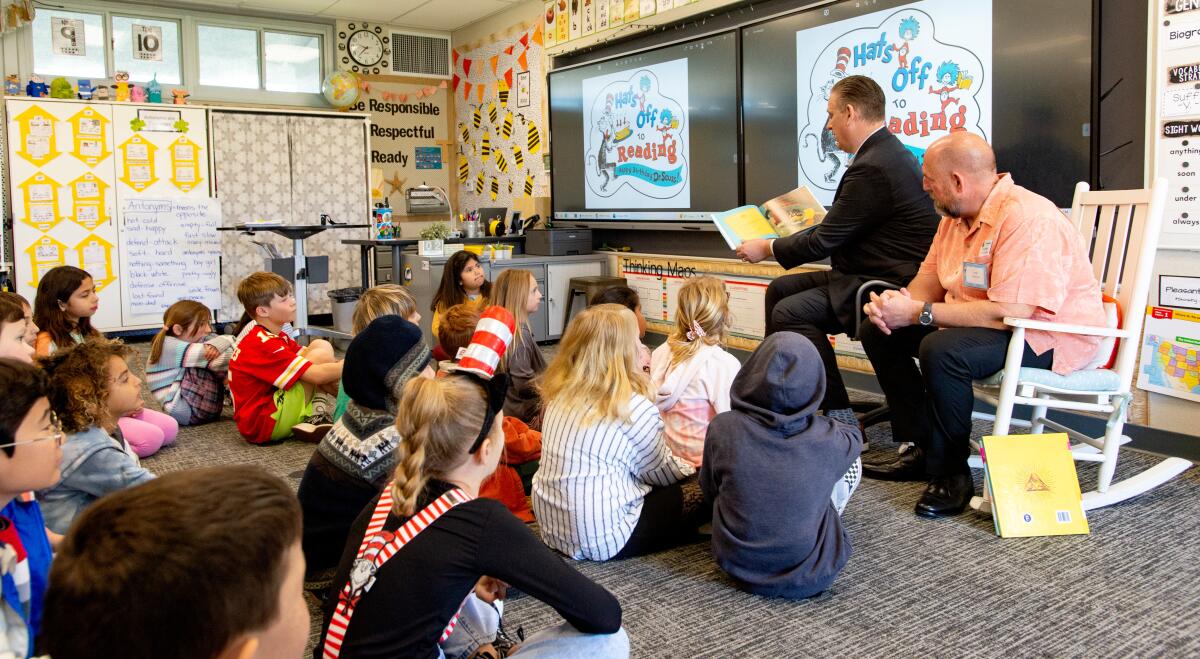 Councilman Pat Burns and Mayor Tony Strickland read stories at Peterson Elementary.