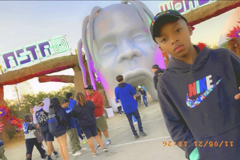 This photo provided by Taylor Blount shows Ezra Blount, 9, posing outside the Astroworld music festival in Houston. Ezra was injured at the concert during a crowd surge. (Courtesy of Taylor Blount via AP)