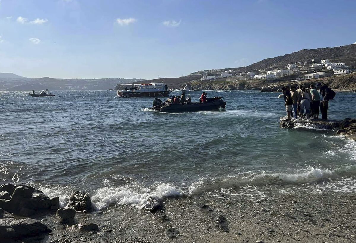 This photo provided by the Hellenic Coast Guard shows a part of a rescue operation on the island of Mykonos, Greece, on Sunday, Jun 19, 2022. Greek authorities said Sunday they have rescued 108 migrants from a sailboat that was found rudderless and leaking water in the Aegean Sea in near gale force winds. (Hellenic Coast Guard via AP)