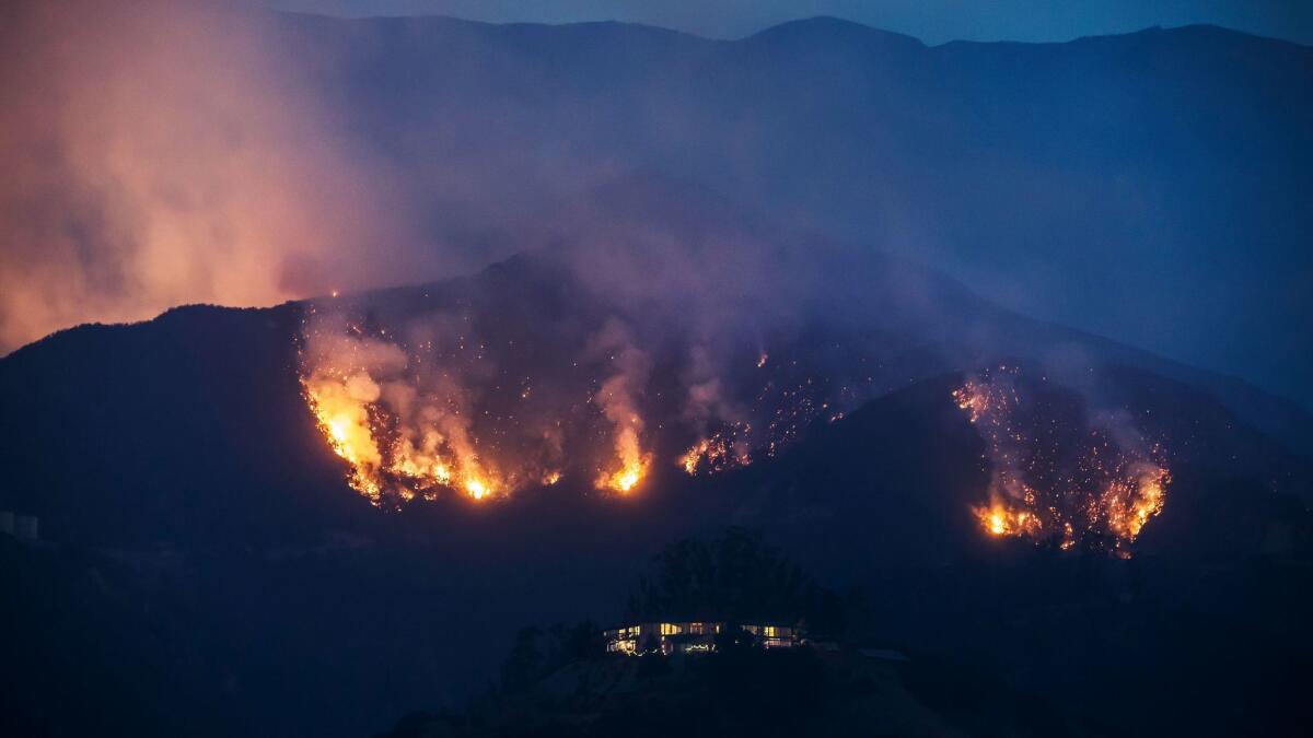 The Thomas Fire make its way down the ridges threatening homes in the mountains above Montecito on Dec. 11, 2017.