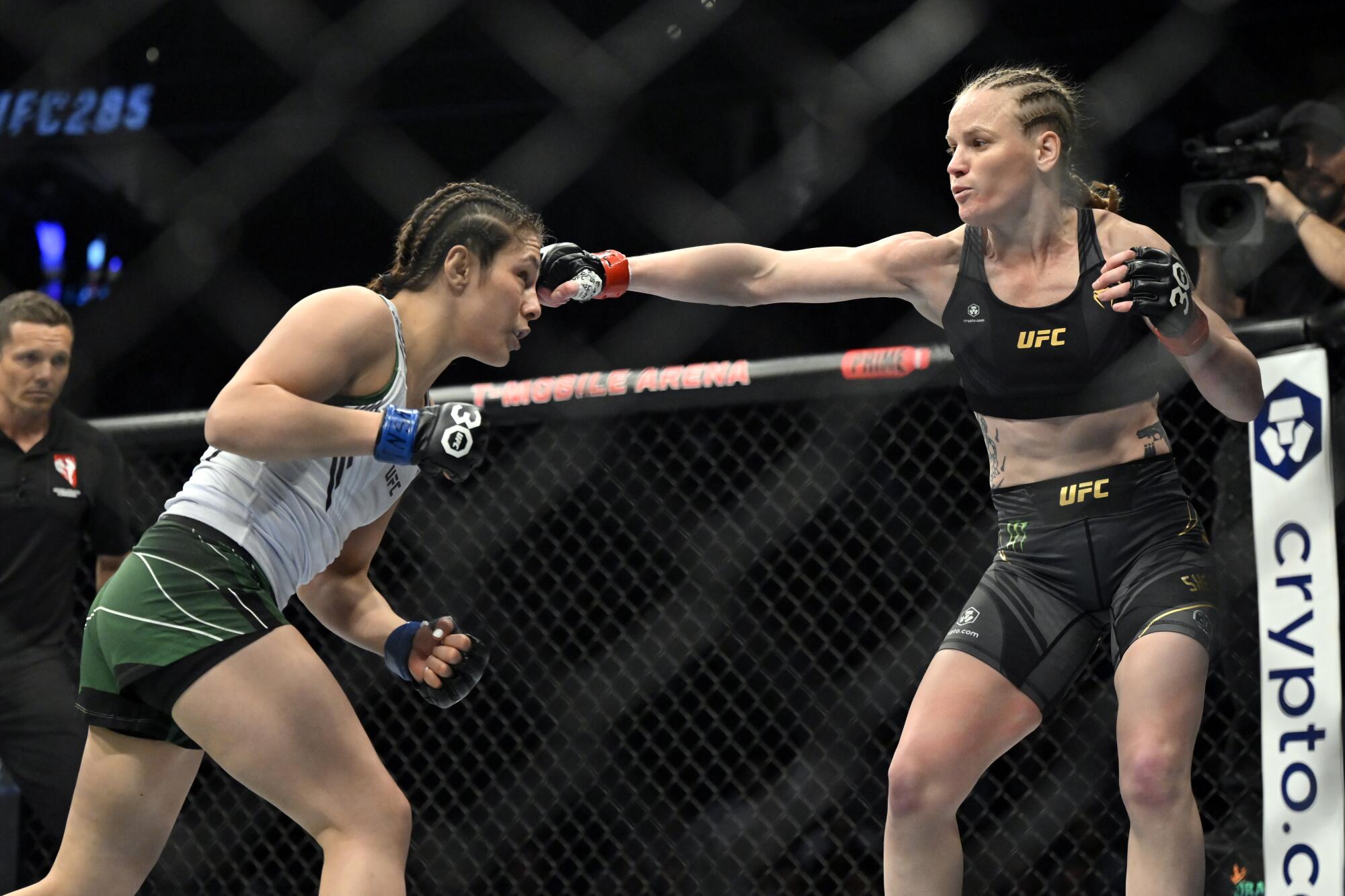 Valentina Shevchenko throws a right at Alexa Grasso, left.