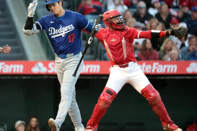 ANAHEIM, CALIFORNIA - MARCH 26: Dodgers Shohei Ohtani strikes out in the fourth inning against the Angels at Angels Stadium Tuesday. (Wally Skalij/Los Angeles Times)
