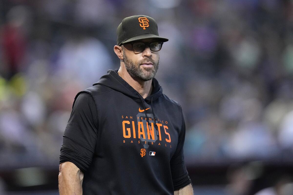 San Francisco Giants manager Gabe Kapler walks back to the dugout during a game against Arizona.