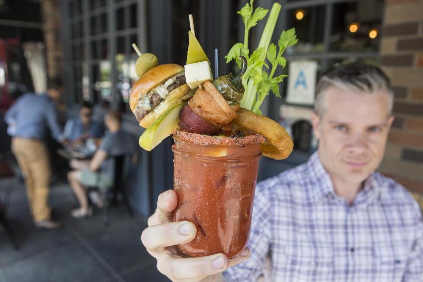 Larry Caldwell shows a glass of the Bloody Royale at Franklin & Company. The first Bloody Mary Battle is taking place June 28 in Santa Monica.