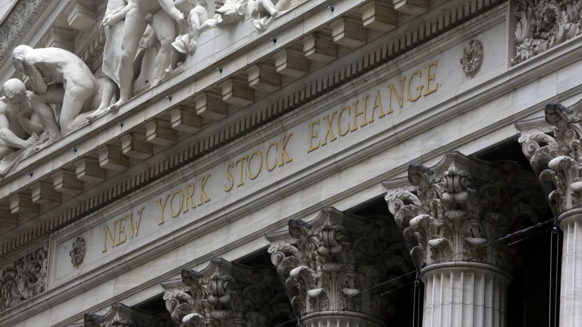 The facade of the New York Stock Exchange. The S&P 500 and Nasdaq indexes closed at record highs Tuesday, recovering all the ground they lost in a nosedive late last year.