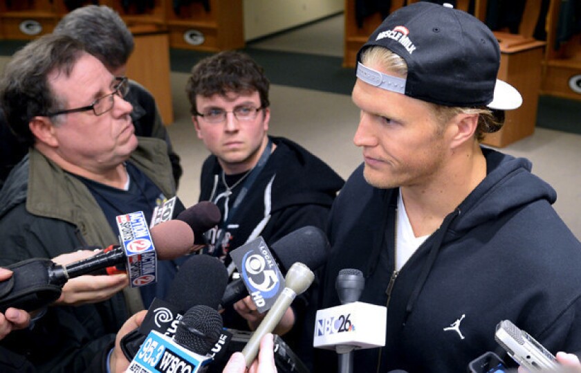 Packers linebacker Clay Matthews talks to reporters in the team's locker room after signing his new contract Wednesday.
