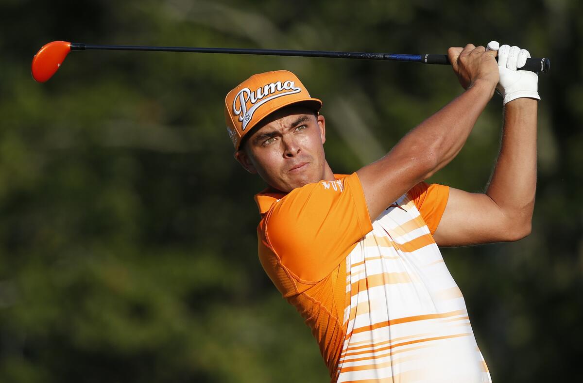 Rickie Fowler tees off on the 17th hole during the final round of the Deutsche Bank Championship golf tournament in Norton, Mass.
