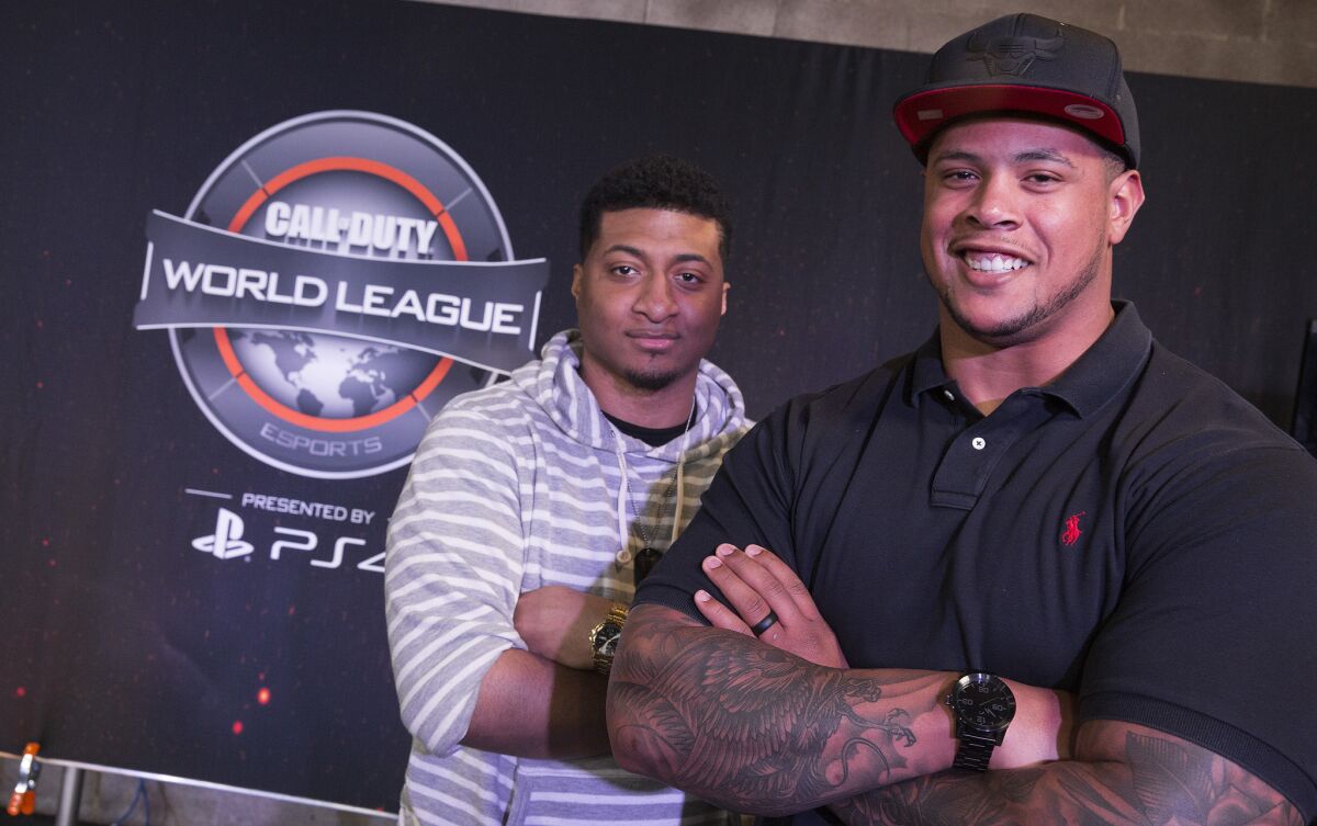 From left, Kahreem Horsley and Rodger Saffold are co-owners of the Rise Nation "Call of Duty" World League eSports team. (Brian van der Brug / Los Angeles Times)