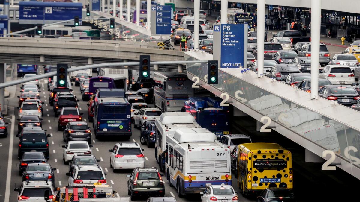 Traffic jams the central terminal area at LAX during the holidays last year. Airport officials hope to reduce the congestion with a $5-billion ground transportation improvement plan that is now being challenged in court.