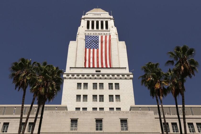 LOS ANGELES, CA  SEPTEMBER 8, 2017: The United States flag is draped on the South Side of Los Angeles City Hall Friday September 8, 2017 as the city went from avoiding the 'sanctuary city' label to embracing it. (Al Seib / Los Angeles Times)